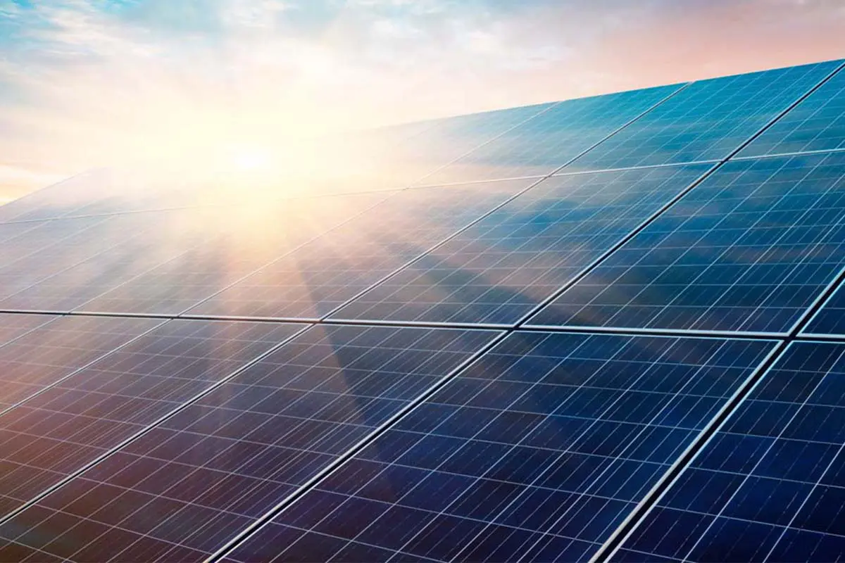solar-panels-sun-flare Solar panels with sun flare at sunrise or sunset.